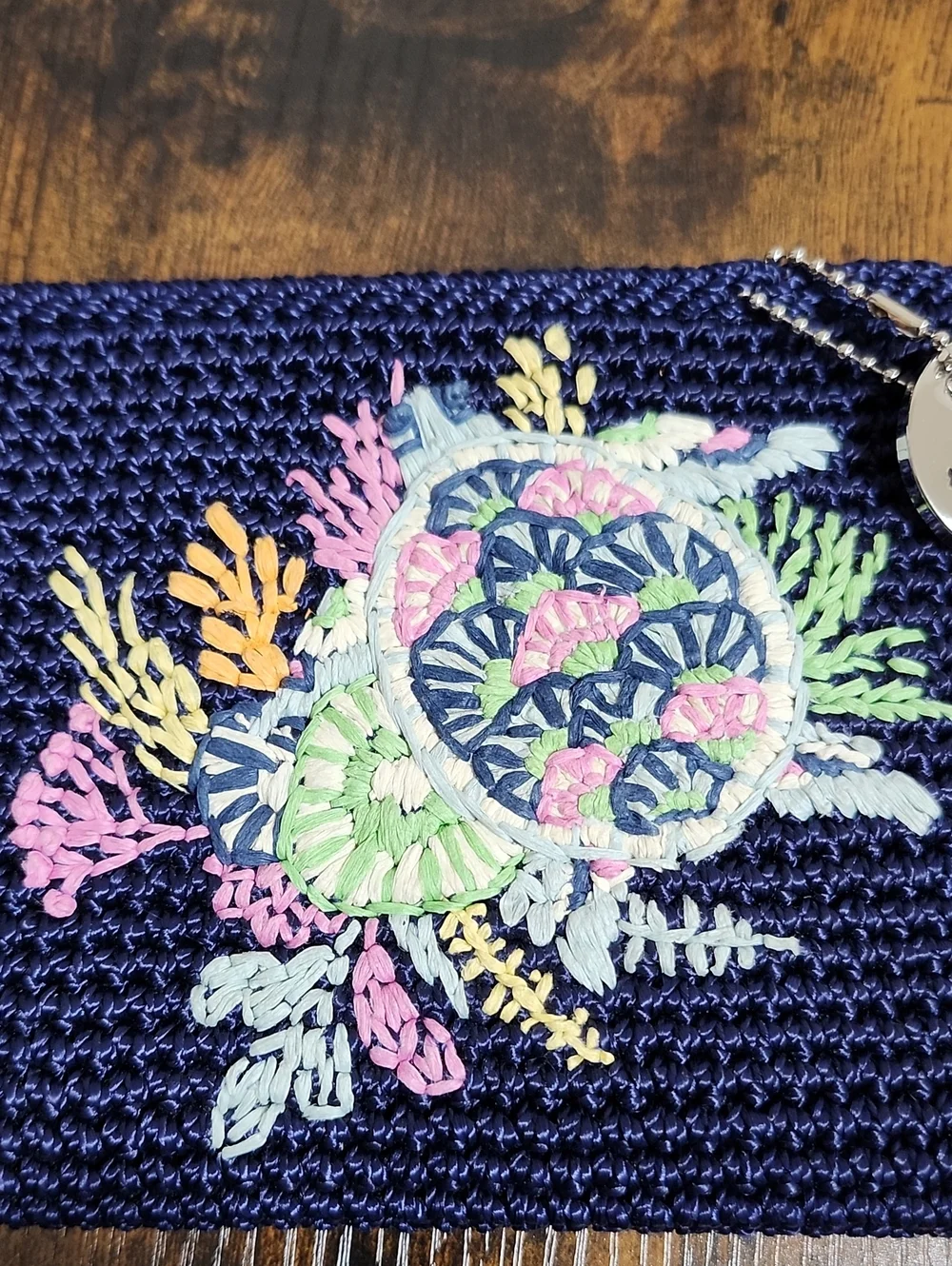 The Sak Navy Crochet Wristlet with Silver Logo Charm, NWT